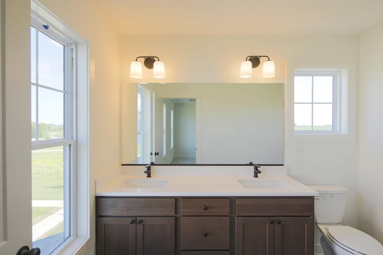 Primary bathroom double vanity in a new construction Homestead townhome