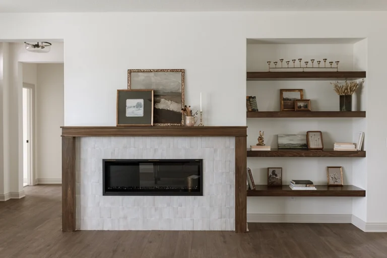 Living room gas fireplace with custom built-in shelving in the Warren Craftsman