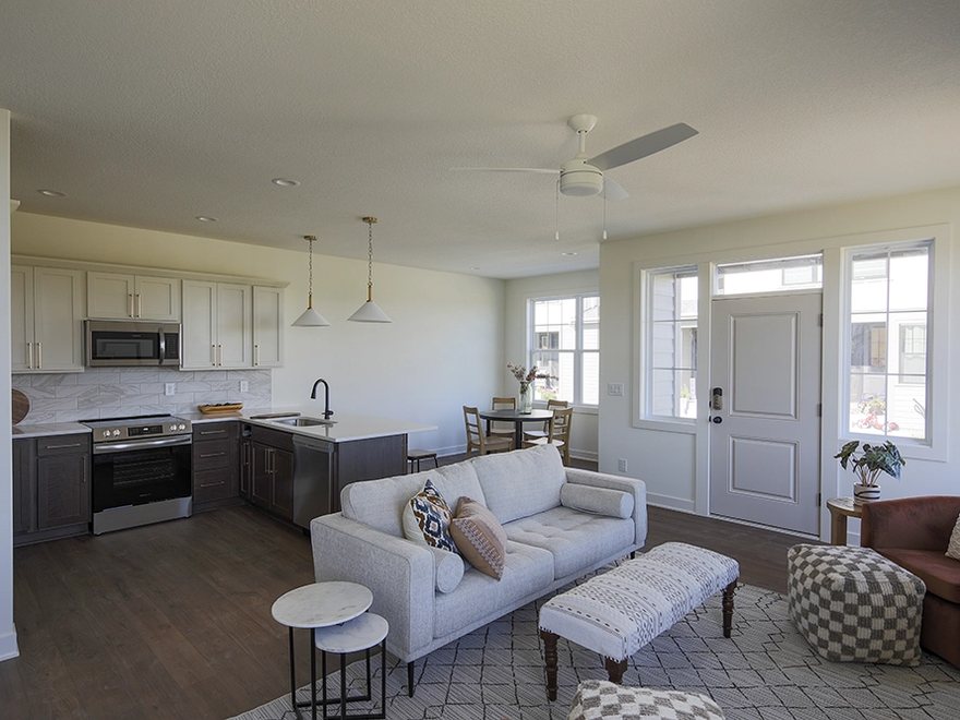 Living room and kitchen in a Ground Breaker home